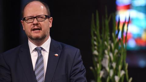 Picture taken on May 5, 2016 shows the mayor of Gdansk Pawel Adamowicz giving a speech during a commemorative ceremony at the St Petri Dom cathedral in Bremen, north-western Germany.