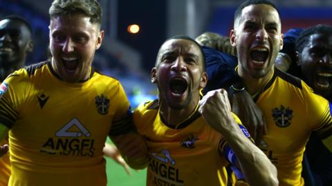 Sutton United celebrate reaching the EFL Trophy final