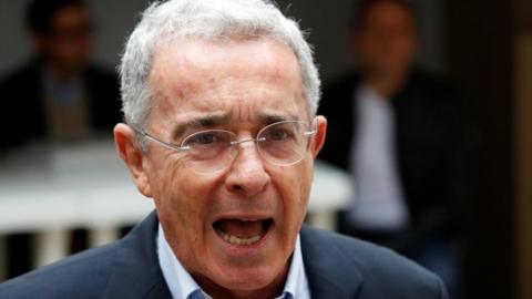 Colombia"s former president Alvaro Uribe Velez speaks to the news media after casting his vote