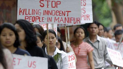 Indian students from the country's northeastern state of Manipur take part in a rally in Bangalore, 13 August 2004, to protest against the alleged killing in military custody of a 30-year-old woman