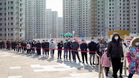 Resident of the Chinese port city of Tianjin queue for Covid tests