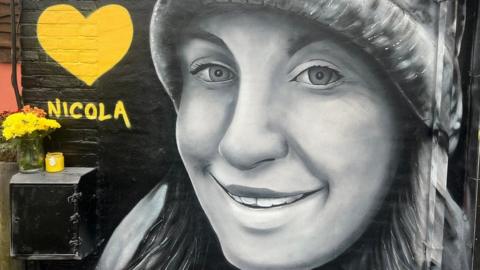 A mural of Nicola Bulley painted at the One Stop shop in South Woodham Ferrers