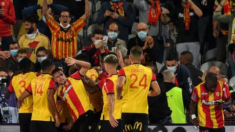 Lens players celebrate