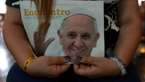 An inmate holds an image of Pope Francis as inmates (not pictured) attend an essay of a choir of female prisoners that will perform for Pope, in Santiago, Chile January 10, 2018.