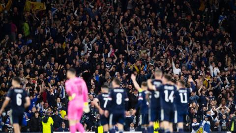 Scotland players applaud their fans