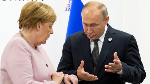 Russian President Vladimir Putin and German Chancellor Angela Merkel at Japan G20 summit, 29 Jun 19