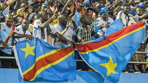 DR Congo fans hold up flags