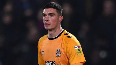 Lloyd Jones playing for Cambridge United