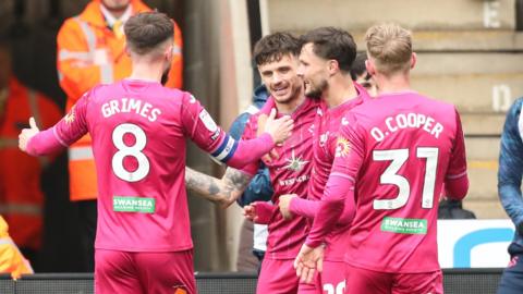Swansea players celebrate Jamie Paterson's goal