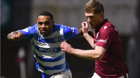 Greenock's Jai Quitongo (L) and Arbroath's Colin Hamilton in action during a cinch Championship match between Arbroath and Greenock Morton at Gayfield Park