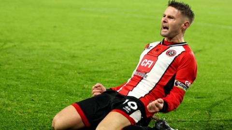 Oliver Norwood celebrates his penalty