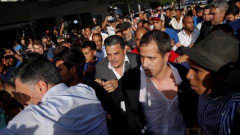 Juan Guaido amid a crowd at the airport