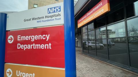 The sign for the emergency department outside the Great Western Hospital (GWH) in Swindon