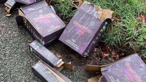 Boxes of nitrous dioxide canisters near the site of the rave