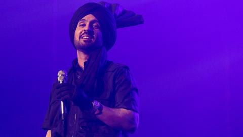 Diljit Dosanjh performs on stage during the Born To Shine World Tour in Vancouver in June 2022