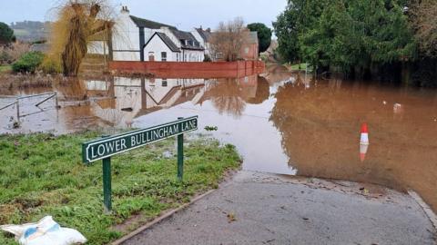 The northern end of Lower Bullingham Lane under water