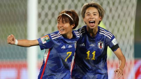 Hinata Miyazawa (L) of Japan celebrates with teammate Mina Tanaka (R)