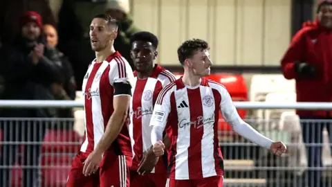 Danny Andrew celebrates scoring for Exeter at Halifax