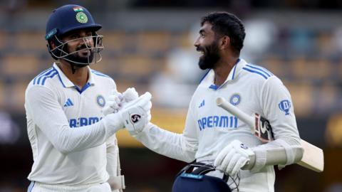 India's Jasprit Bumrah and Akash Deep celebrate leading them past the follow-on target against Australia