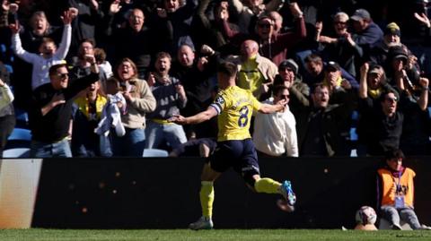 Cameron Brannagan celebrates his high-class equaliser for Oxford United against Cardiff City