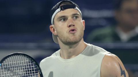 Jack Draper reacts during his match against Quentin Halys at the Dubai Tennis Championships
