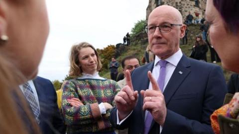 Man points while speaking