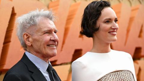 Phoebe Waller-Bridge and Harrison Ford attend the UK premiere of Indiana Jones and the Dial of Destiny at Cineworld Leicester Square on June 26, 2023 in London, England