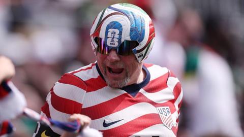 A fan wearing the FIFA World Cup 2026 match ball cheer during the international friendly match between United States and Senegal at Bank of America Stadium on May 31, 2026 in Charlotte, North Carolina. (Photo by David Jensen/USSF/Getty Images)