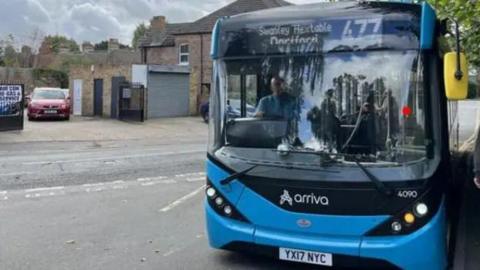 A blue Arriva bus, displaying the destination Dartford and the number 477
