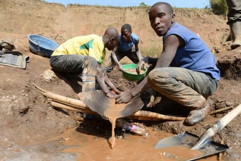 Men separate minerals from rock and sand on May 28, 2013 near the Mudere mine, outside Rubaya, some 9 kms from the eastern Democratic Republic of Congo city of Goma