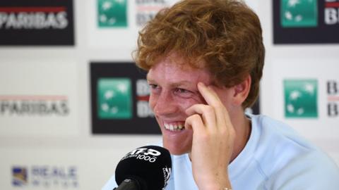 Jannik Sinner speaks at a news conference at the Italian Open
