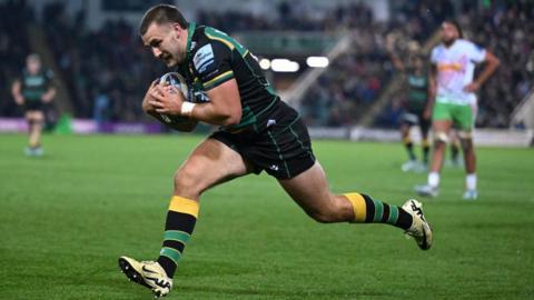 Ollie Sleightholme runs in a try for Northampton Saints