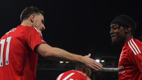 Anthony Elanga congratulates Chris Wood
