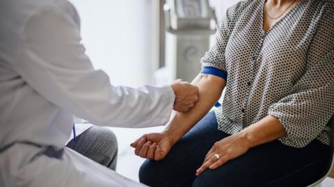 Doctor treating a patient