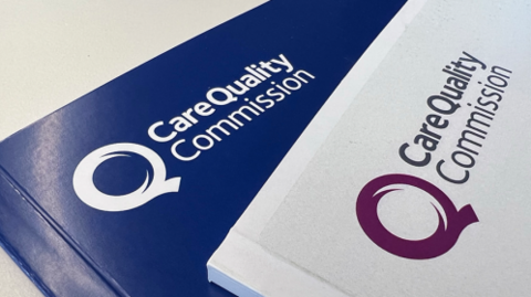 Two books with the Care Quality Commission written on them