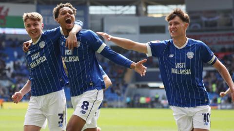 Omari Kellyman celebrates with Cardiff team-mates