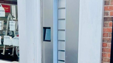 A pod with a silver door and blue lining, is an out-of-hours prescription collection service