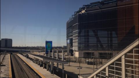 The Meadowlands New Jersey Transit station with the MetLife Stadium in the background.