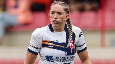 Caitlin Beevers in action for England