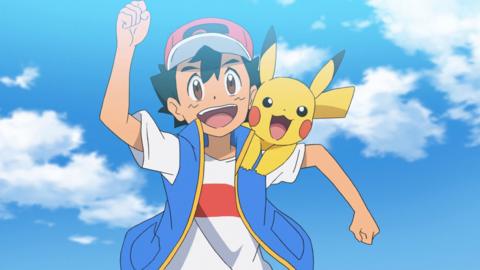 Ash Ketchum with his fist in the air. Pikachu is on his shoulder grinning.