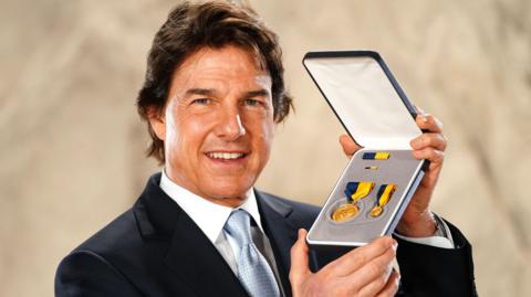 Actor Tom Cruise after being presented with the US Navy Distinguished Public Service Award by US