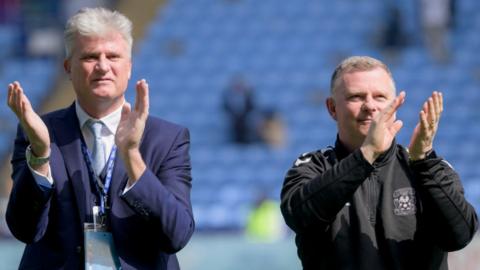 Doud King (left) and Mark Robins acknowledge the Coventry City fans after last season's final game