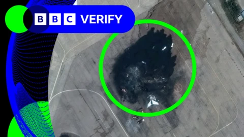 A burned-out Iranian jet at Mashhad airport