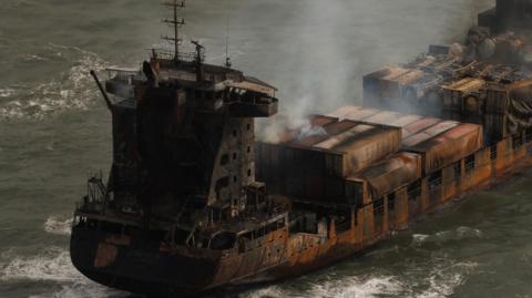 Smoke billows from the MV Solong cargo ship