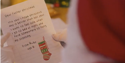 Screenshot from a campaign video of a little girl called Ruby's letter to Father Christmas asking to feel safe this festive season.