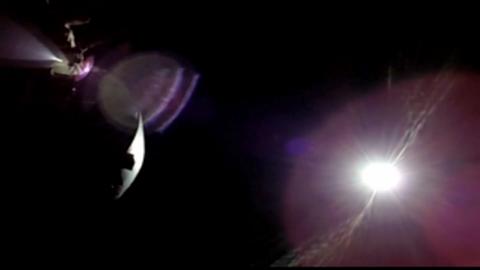 A solar eclipse seen from the dark side of the moon