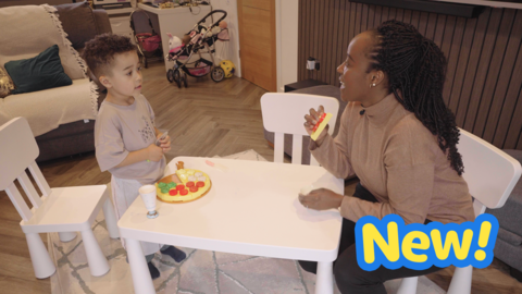 Mum and son share a plastic pizza.