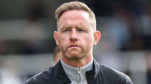 Head shot of Gavin Cowan on the touchline