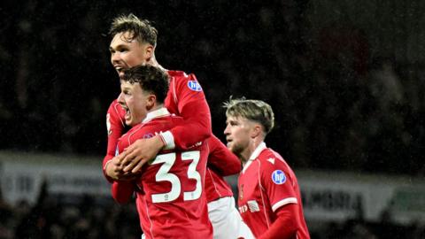 Wrexham's Nathan Broadhead celebrates with Callum Doyle
