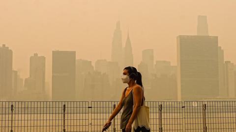 Smoke from massive wildfires in Canada engulfed the New York City skyline, reducing visibility and casting an orange haze over the New York City, United States on July 16, 2026.